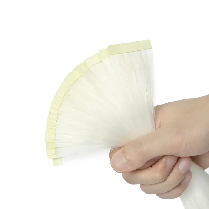 Extensions de cheveux synthétiques à bandes adhésives