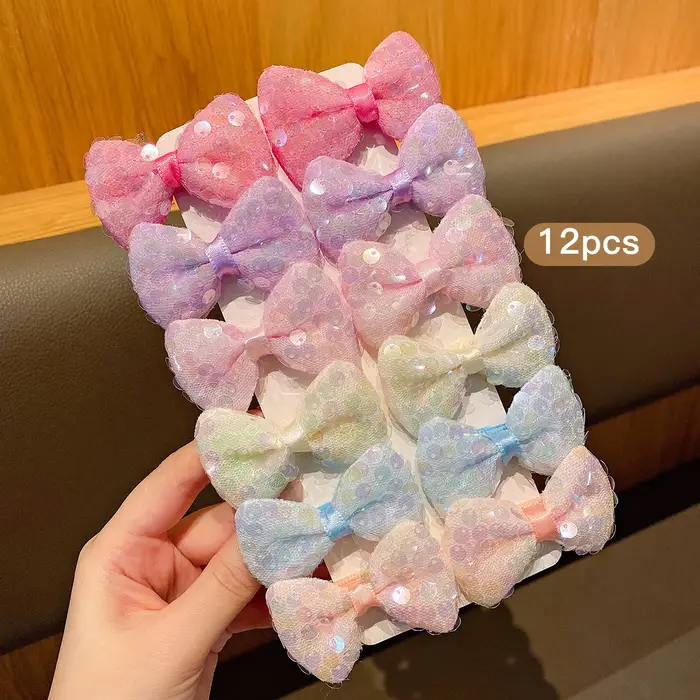 12 pinces à cheveux avec nœud à paillettes colorées
