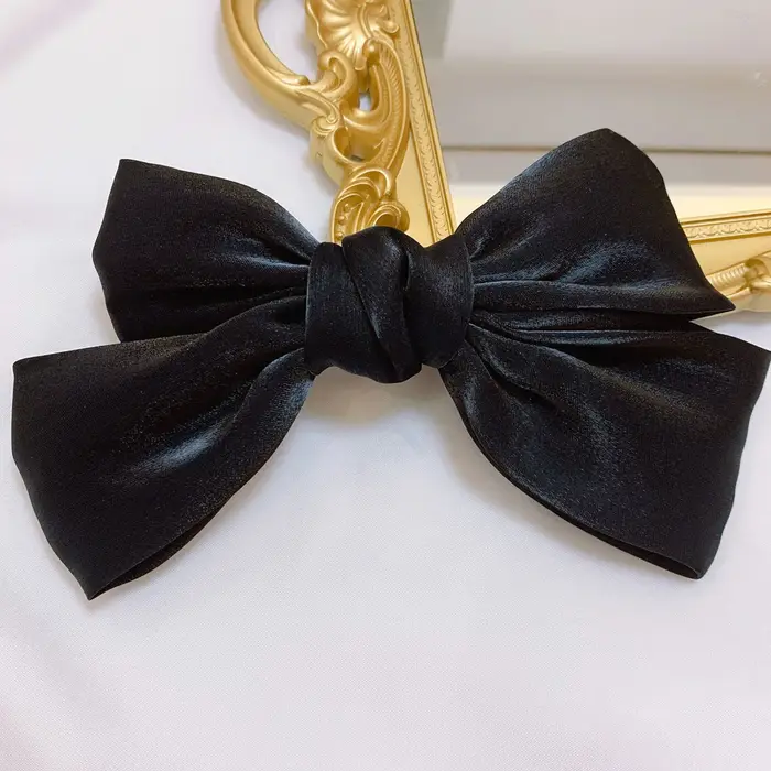 Pince à cheveux à nœud papillon brillant