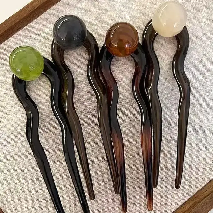 Bâtonnets de cheveux en perles