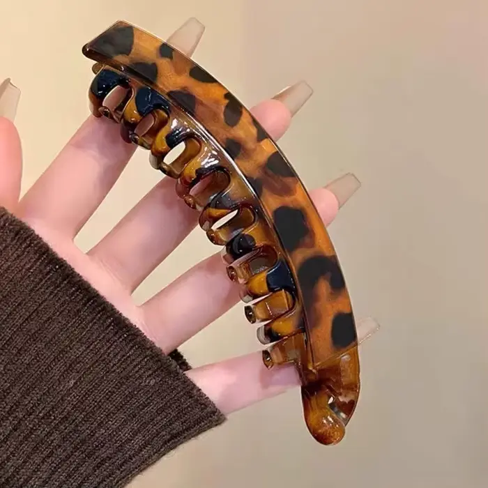 Grande pince à queue haute avec moelleux naturel et volume de cheveux accru. Pince banane avec clip 