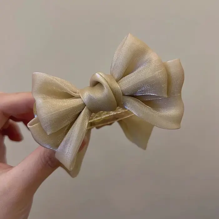 Pince à cheveux élégante pour chignon avec nœud papillon