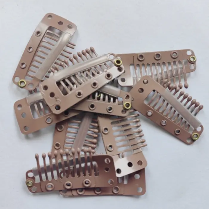 Clips à clipser pour extensions de cheveux humains