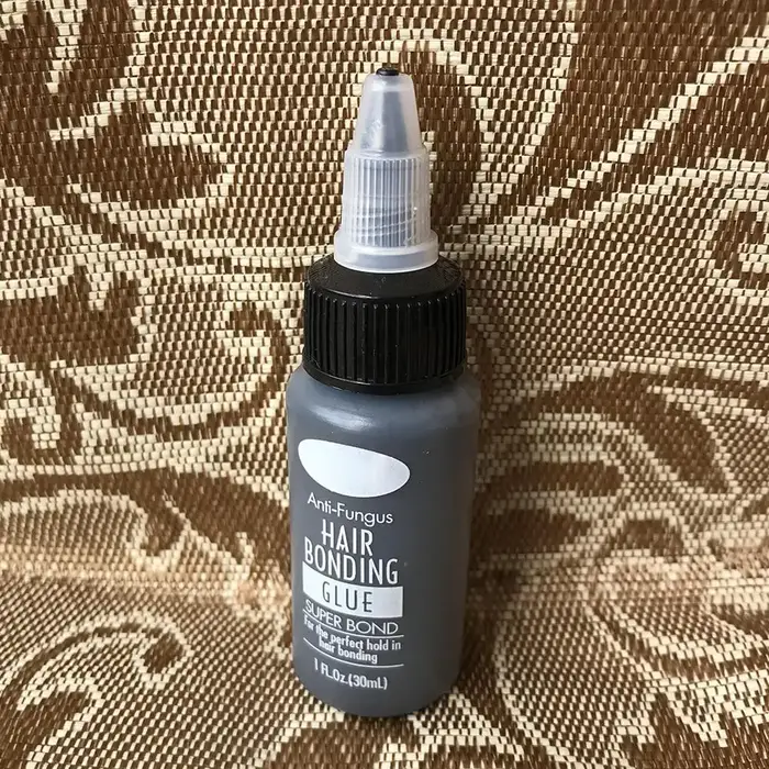 Colle adhésive puissante anti-fongique pour tissage de cheveux noirs 30ml